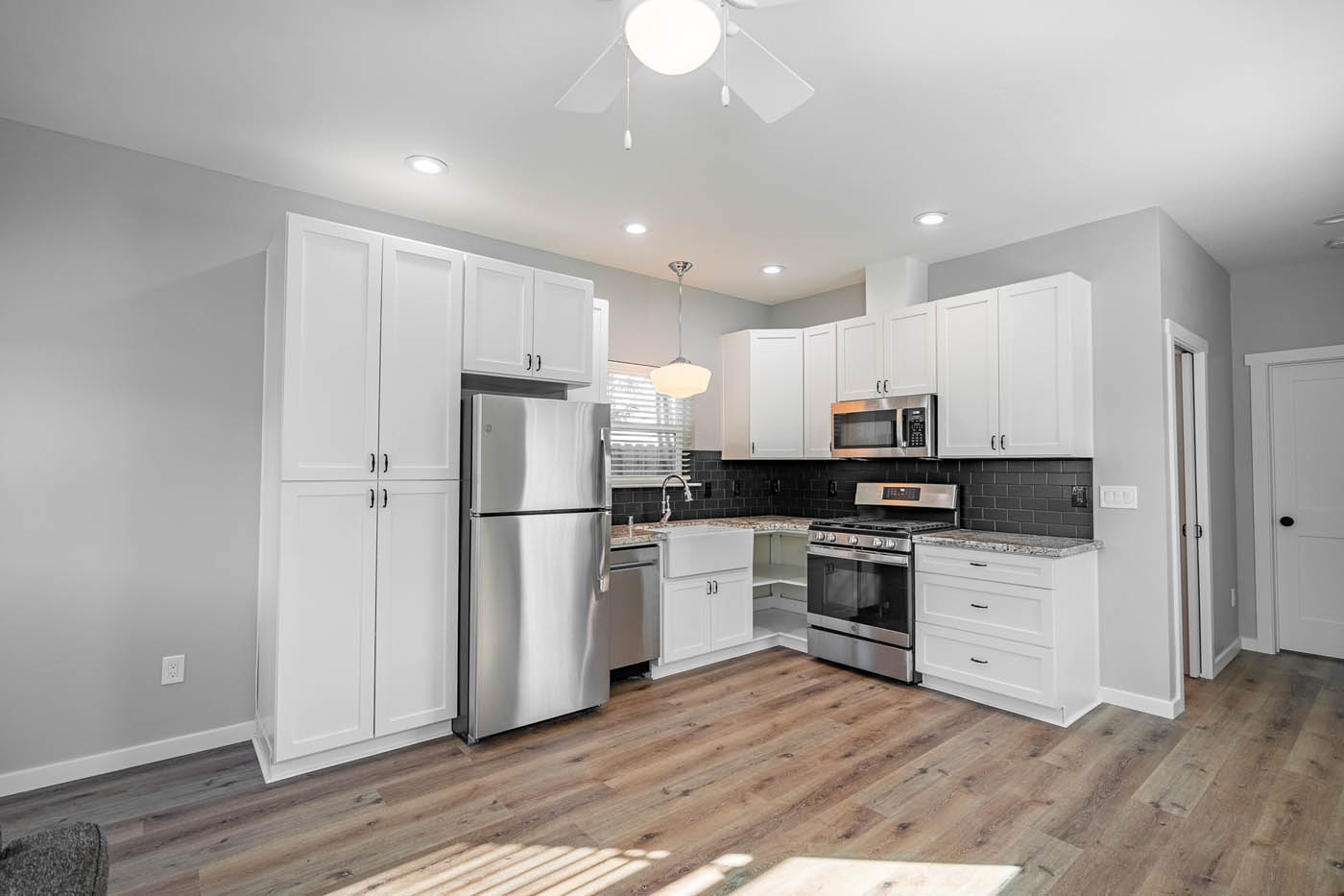 A beautiful white kitchen in an ADU home, contact our Collegeville / Quakertown tiny house company today.